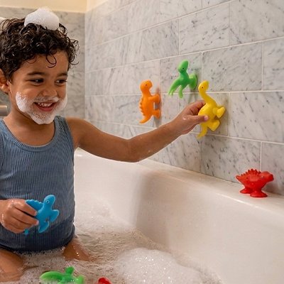 Jouet de bain enfant joue avec dinosaure jaune vert rouge