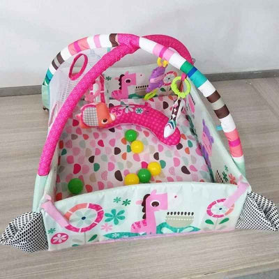 tapis d'éveil bébé rose avec balle verte