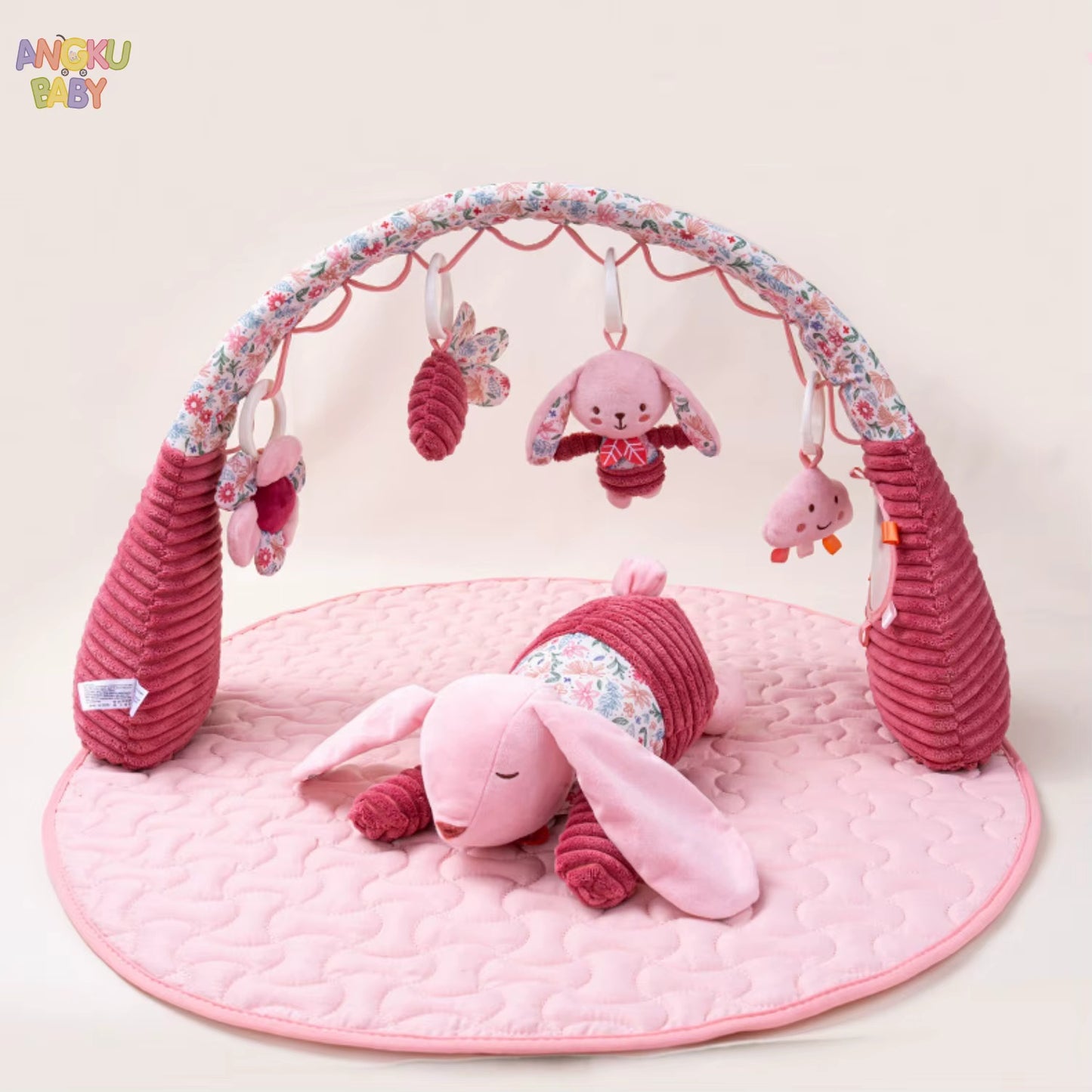 tapis d'éveil rose et jouet